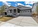 Charming single Gathering home featuring a cozy front porch and a two-car attached garage at 24788 E 40Th Ave, Aurora, CO 80019