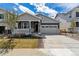 Charming single Gathering home featuring a cozy front porch and a two-car attached garage at 24788 E 40Th Ave, Aurora, CO 80019