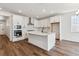 Modern kitchen with stainless steel appliances, white cabinets, and a large kitchen island at 24788 E 40Th Ave, Aurora, CO 80019