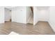The finished basement features new flooring, neutral walls, and a staircase leading to the main level at 2161 Willow Ct, Denver, CO 80238
