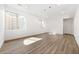 Spacious basement offers new laminate floors, light neutral paint, recessed lighting, and natural light from windows at 2161 Willow Ct, Denver, CO 80238