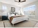 Bedroom with a ceiling fan, rug, and windows bringing in tons of natural light at 2161 Willow Ct, Denver, CO 80238