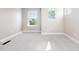 Spacious empty bedroom with carpet and multiple bright windows at 2161 Willow Ct, Denver, CO 80238