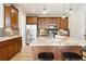 Modern kitchen with stainless steel appliances, granite countertops, and a center island with seating at 2161 Willow Ct, Denver, CO 80238