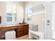Bright mudroom features a built-in desk, bench seating, hooks, and storage cabinets at 2161 Willow Ct, Denver, CO 80238