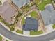 Aerial view of a home with a stone patio and a backyard with luscious landscaping at 2463 Tavern Way, Castle Rock, CO 80104