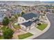 Beautiful aerial view showcasing the home's manicured lawn, fenced yard, and neighborhood setting at 2463 Tavern Way, Castle Rock, CO 80104