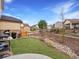 Backyard with a small lawn, landscaping, and a grill at 2463 Tavern Way, Castle Rock, CO 80104