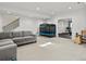 Spacious basement features plush carpeting, ample lighting, and recreational area with a couch at 2463 Tavern Way, Castle Rock, CO 80104