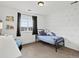 Charming bedroom with dinosaur wall decorations, black out curtains, and ample light at 2463 Tavern Way, Castle Rock, CO 80104