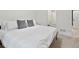 Bright bedroom with natural light from the window and a neatly made bed with white linens at 2463 Tavern Way, Castle Rock, CO 80104