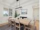Formal dining room with a large table, seating for eight, and a view of the outdoors through the window at 2463 Tavern Way, Castle Rock, CO 80104