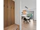 Welcoming entryway with a built-in storage bench and coat hooks, leading to an open-concept kitchen and dining area at 2463 Tavern Way, Castle Rock, CO 80104