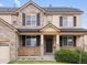 Attractive home featuring a stone facade, a dark front door, and traditional shutters at 2463 Tavern Way, Castle Rock, CO 80104