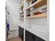 Pantry with open shelving, cabinets, and countertops for food storage at 2463 Tavern Way, Castle Rock, CO 80104