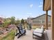Charming outdoor patio with stylish furniture surrounded by a beautifully landscaped yard at 2463 Tavern Way, Castle Rock, CO 80104