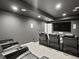 Home theater with comfortable seating, a large screen, and dark walls for an immersive experience at 2463 Tavern Way, Castle Rock, CO 80104