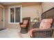 Cozy front porch with wicker chairs and an outdoor table perfect for relaxing and enjoying the scenery at 8112 Gray Ct # 394, Arvada, CO 80003