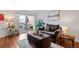 Cozy living room with a sliding glass door leading to the deck, perfect for indoor-outdoor living at 8112 Gray Ct # 394, Arvada, CO 80003