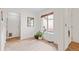 Bright eating area with tile flooring next to back door and window view at 8112 Gray Ct # 394, Arvada, CO 80003