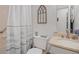 Cozy bathroom featuring white fixtures and a decorative window at 8112 Gray Ct # 394, Arvada, CO 80003