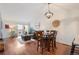 Bright living room with hardwood floors, vaulted ceilings, modern lighting, and slider to deck for indoor/outdoor living at 8112 Gray Ct # 394, Arvada, CO 80003