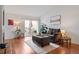 Inviting living room with hardwood floors and access to a cozy outdoor patio space at 8112 Gray Ct # 394, Arvada, CO 80003