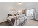 Comfortable main bedroom featuring a decorative metal bed frame and soft, neutral colors at 8112 Gray Ct # 394, Arvada, CO 80003