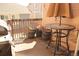 Inviting patio featuring a grill, table with umbrella, and decorative potted plants at 8112 Gray Ct # 394, Arvada, CO 80003