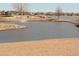 Picturesque community pond featuring a fountain, grassy banks, and recreational space at 8112 Gray Ct # 394, Arvada, CO 80003