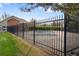 Community pool and fence as seen from grassy lawn at 8112 Gray Ct # 394, Arvada, CO 80003