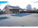 Community pool with a partially covered pool area and a large pool with a safety cover at 8112 Gray Ct # 394, Arvada, CO 80003