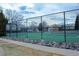 Well-maintained community tennis courts with black fencing and lush landscaping at 8112 Gray Ct # 394, Arvada, CO 80003