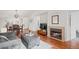 Inviting living room with a cozy fireplace, hardwood floors, and comfortable seating for a warm atmosphere at 8112 Gray Ct # 394, Arvada, CO 80003