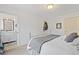 Bedroom showcasing a metal bed frame, neutral decor, and a glimpse into the en-suite bathroom at 8112 Gray Ct # 394, Arvada, CO 80003