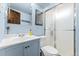 This bathroom has a white vanity, toilet, and glass enclosed shower stall at 9231 Irving St, Westminster, CO 80031