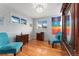 Bright bedroom with hardwood floors, chandelier and a pair of sitting chairs at 9231 Irving St, Westminster, CO 80031