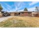 Charming brick home with a well-maintained front yard, offering a classic and inviting curb appeal at 9231 Irving St, Westminster, CO 80031