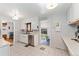 Functional kitchen with white cabinetry, neutral countertops, and seamless access to dining area at 9231 Irving St, Westminster, CO 80031