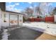 Deck and backyard with snowy ground and privacy fence at 1557 S Pierson St, Lakewood, CO 80232
