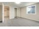 Finished basement bedroom with mirrored closet and carpet at 1557 S Pierson St, Lakewood, CO 80232