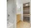 Basement bathroom with tub and walk-in closet at 1557 S Pierson St, Lakewood, CO 80232