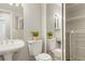 Full bathroom with double vanity and linen closet at 1557 S Pierson St, Lakewood, CO 80232