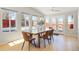 Bright dining area with a live-edge table and access to the backyard at 1557 S Pierson St, Lakewood, CO 80232