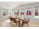 Sun-drenched dining room with backyard access and wooden table at 1557 S Pierson St, Lakewood, CO 80232