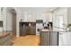 Updated kitchen with granite countertops and white cabinets at 1557 S Pierson St, Lakewood, CO 80232