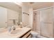 Clean bathroom featuring a glass-enclosed shower, vanity, and updated fixtures at 13850 E Marina Dr # 210, Aurora, CO 80014