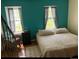 Bright bedroom featuring two large windows, hardwood floors, and neutral decor at 2285 S Jasper Way # A, Aurora, CO 80013