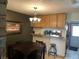 Cozy dining area featuring dark wood table, matching chairs and a decorative chandelier at 2285 S Jasper Way # A, Aurora, CO 80013