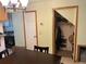 View of kitchen and adjacent closet. Washer/dryer visible near the kitchen sink and cabinets at 2285 S Jasper Way # A, Aurora, CO 80013